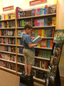 My son, reading without requirement in a Barnes and Noble