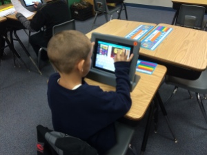 A student uses the app Canva to create a visual report about a human body system.